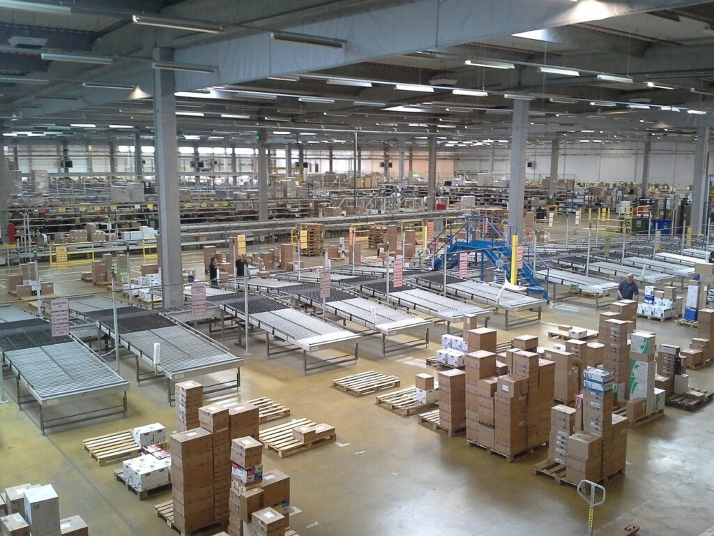 A warehouse that has many corrugated boxes being made.